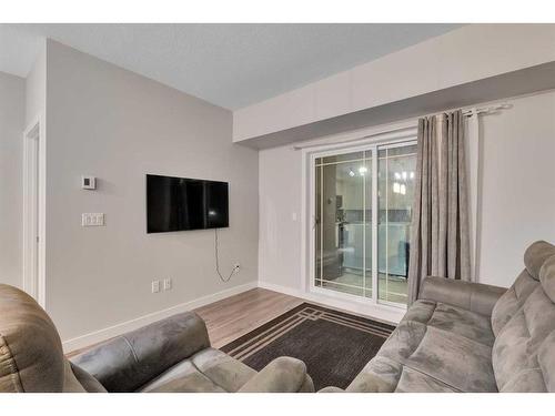 111-300 Auburn Meadows Manor Se, Calgary, AB - Indoor Photo Showing Living Room