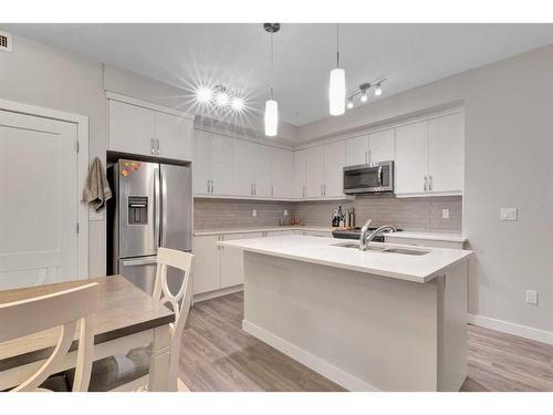 111-300 Auburn Meadows Manor Se, Calgary, AB - Indoor Photo Showing Kitchen With Stainless Steel Kitchen