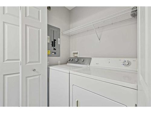 1102-7171 Coach Hill Road Sw, Calgary, AB - Indoor Photo Showing Laundry Room