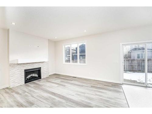 23 Homestead Passage Ne, Calgary, AB - Indoor Photo Showing Living Room With Fireplace