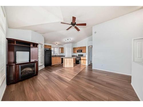 202-100 Panatella Landing Nw, Calgary, AB - Indoor Photo Showing Other Room With Fireplace