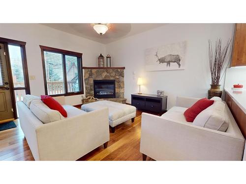 614 8Th Avenue Sw, Canmore, AB - Indoor Photo Showing Living Room With Fireplace