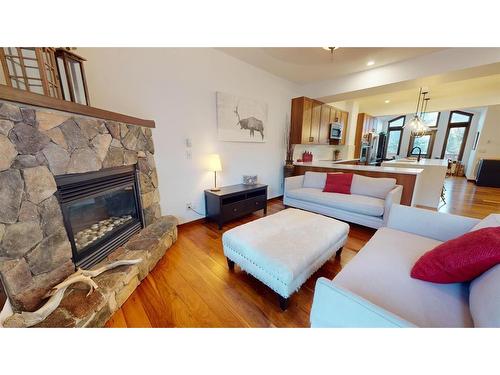 614 8Th Avenue Sw, Canmore, AB - Indoor Photo Showing Living Room With Fireplace