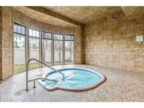 3401-92 Crystal Shores Road, Okotoks, AB - Indoor Photo Showing Other Room With In Ground Pool