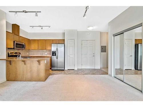 3401-92 Crystal Shores Road, Okotoks, AB - Indoor Photo Showing Kitchen With Stainless Steel Kitchen