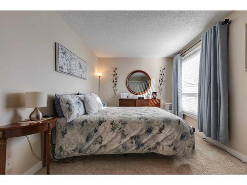 231 Deerpoint Lane Se, Calgary, AB - Indoor Photo Showing Bedroom