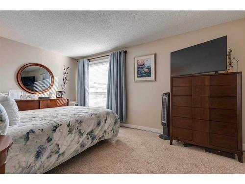 231 Deerpoint Lane Se, Calgary, AB - Indoor Photo Showing Bedroom