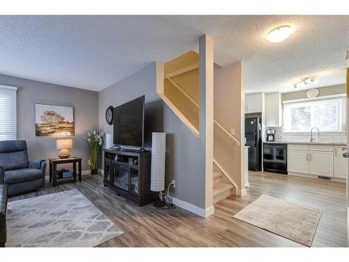 231 Deerpoint Lane Se, Calgary, AB - Indoor Photo Showing Living Room