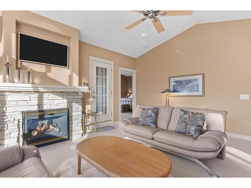 303-3 Aspen Glen, Canmore, AB - Indoor Photo Showing Living Room With Fireplace