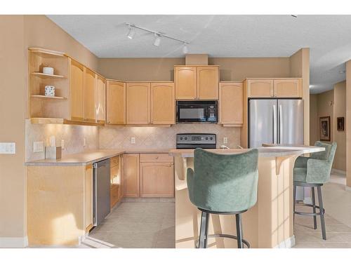 303-3 Aspen Glen, Canmore, AB - Indoor Photo Showing Kitchen