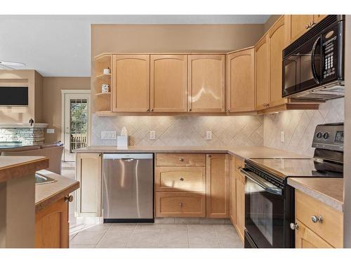 303-3 Aspen Glen, Canmore, AB - Indoor Photo Showing Kitchen