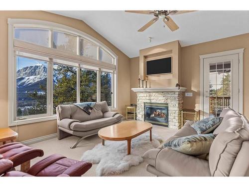 303-3 Aspen Glen, Canmore, AB - Indoor Photo Showing Living Room With Fireplace