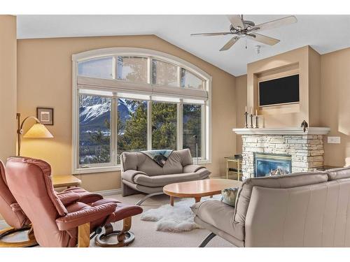 303-3 Aspen Glen, Canmore, AB - Indoor Photo Showing Living Room With Fireplace