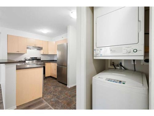 2403-505 Railway Street West, Cochrane, AB - Indoor Photo Showing Laundry Room