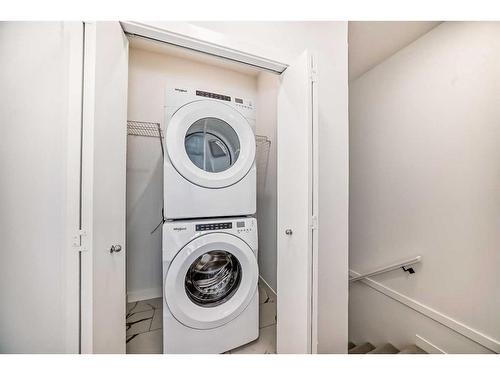 102-6 Merganser Drive West, Chestermere, AB - Indoor Photo Showing Laundry Room