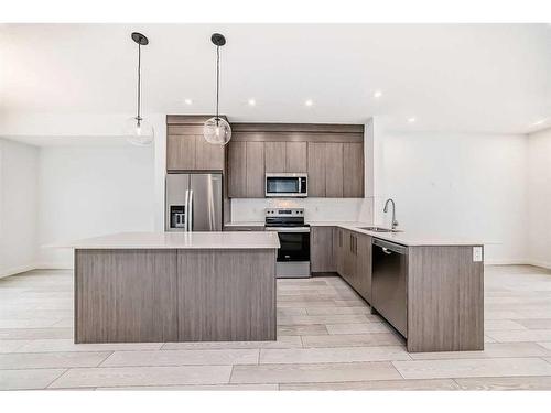 102-6 Merganser Drive West, Chestermere, AB - Indoor Photo Showing Kitchen With Stainless Steel Kitchen With Upgraded Kitchen