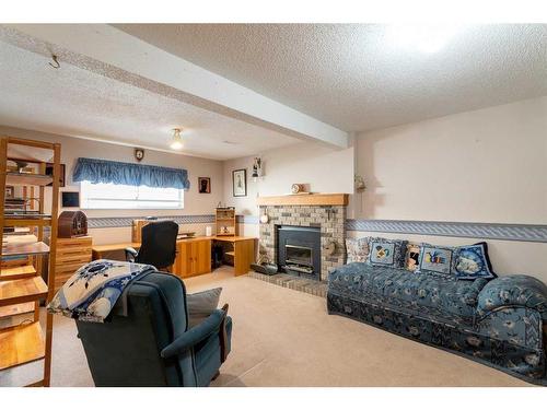 212 Riverstone Place Se, Calgary, AB - Indoor With Fireplace