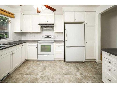 4124 Brisebois, Calgary, AB - Indoor Photo Showing Kitchen With Double Sink