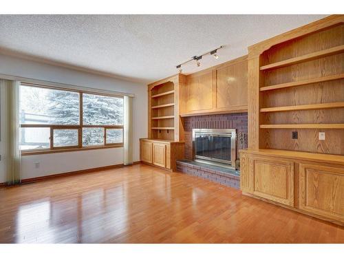 65 Christie Park View Sw, Calgary, AB - Indoor With Fireplace