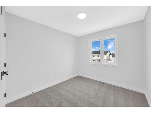 118 Versant View Sw, Calgary, AB - Indoor Photo Showing Other Room