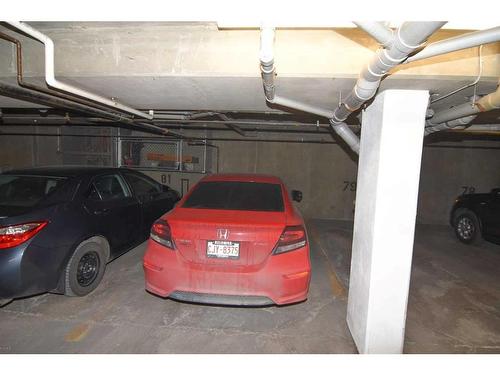 305-6800 Hunterview Drive Nw, Calgary, AB - Indoor Photo Showing Garage