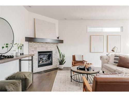 65 Auburn Springs Place Se, Calgary, AB - Indoor Photo Showing Living Room With Fireplace