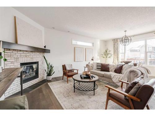 65 Auburn Springs Place Se, Calgary, AB - Indoor Photo Showing Living Room With Fireplace