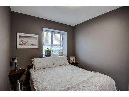 1202-2066 Luxstone Boulevard Sw, Airdrie, AB - Indoor Photo Showing Bedroom