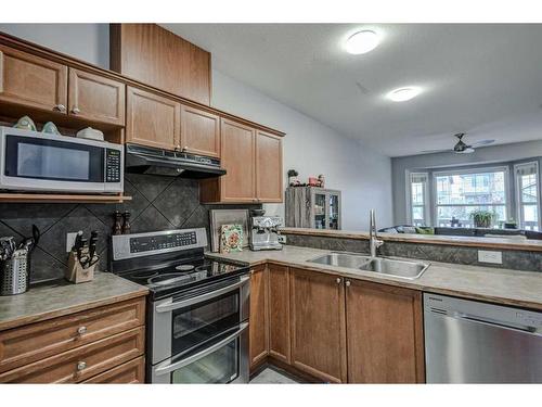 1202-2066 Luxstone Boulevard Sw, Airdrie, AB - Indoor Photo Showing Kitchen With Double Sink