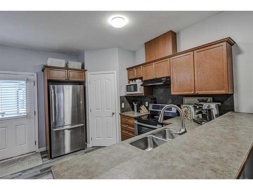 1202-2066 Luxstone Boulevard Sw, Airdrie, AB - Indoor Photo Showing Kitchen With Double Sink