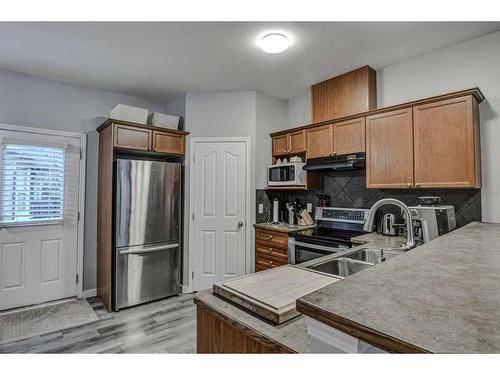 1202-2066 Luxstone Boulevard Sw, Airdrie, AB - Indoor Photo Showing Kitchen With Double Sink