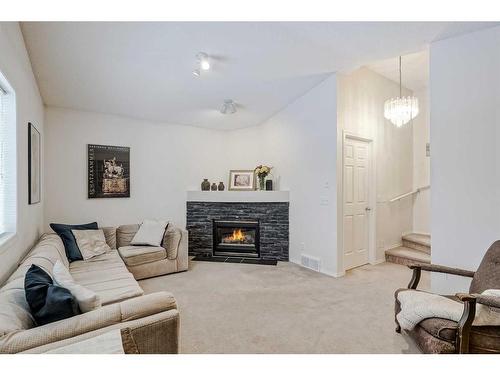 238 Citadel Meadow Grove Nw, Calgary, AB - Indoor Photo Showing Living Room With Fireplace