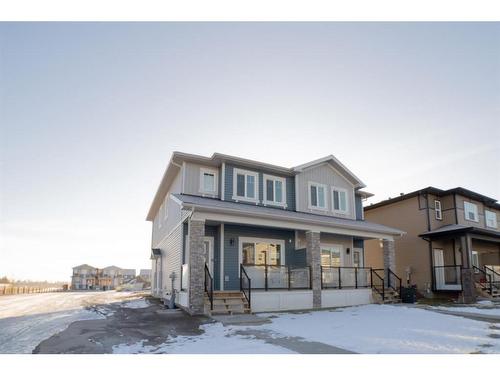 261 Midgrove Mews Sw, Airdrie, AB - Outdoor With Facade