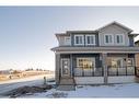 261 Midgrove Mews Sw, Airdrie, AB  - Outdoor With Facade 