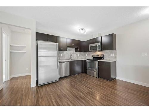 306-250 Sage Valley Road Nw, Calgary, AB - Indoor Photo Showing Kitchen With Stainless Steel Kitchen