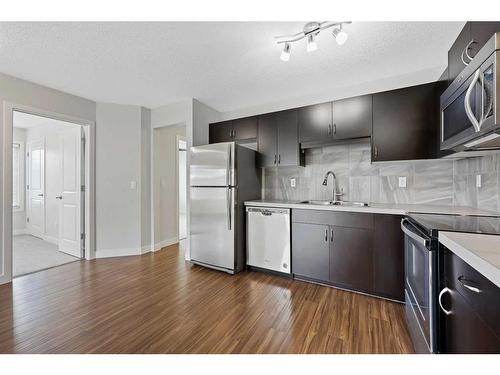 306-250 Sage Valley Road Nw, Calgary, AB - Indoor Photo Showing Kitchen With Stainless Steel Kitchen