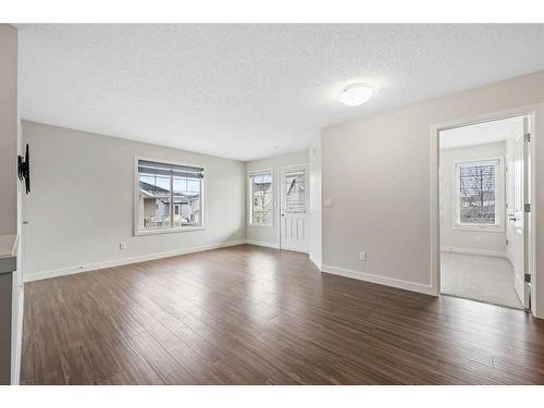 306-250 Sage Valley Road Nw, Calgary, AB - Indoor Photo Showing Living Room