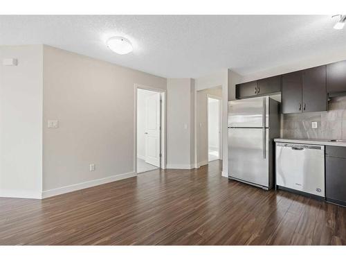 306-250 Sage Valley Road Nw, Calgary, AB - Indoor Photo Showing Kitchen With Stainless Steel Kitchen