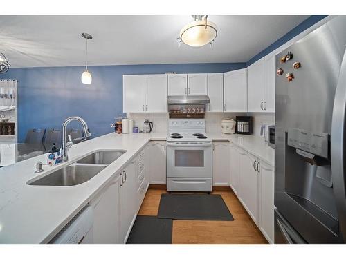 55 Erin Crescent Se, Calgary, AB - Indoor Photo Showing Kitchen With Double Sink