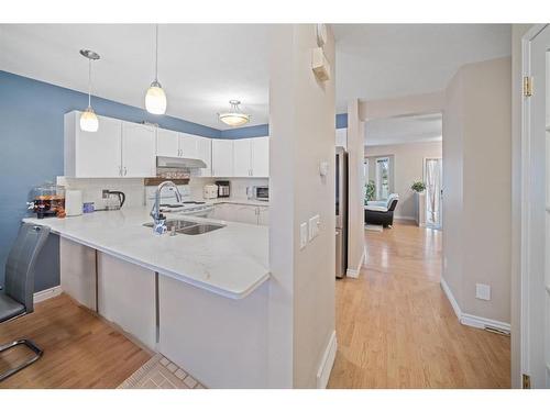 55 Erin Crescent Se, Calgary, AB - Indoor Photo Showing Kitchen With Double Sink