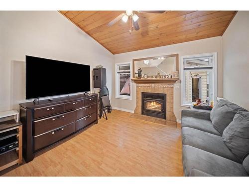 55 Erin Crescent Se, Calgary, AB - Indoor Photo Showing Living Room With Fireplace