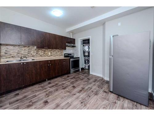 115 Savanna Parade Ne, Calgary, AB - Indoor Photo Showing Kitchen With Double Sink With Upgraded Kitchen