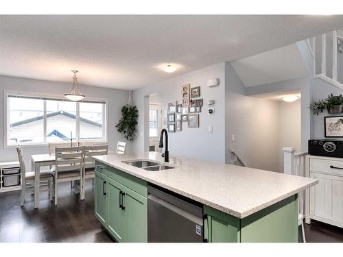 11 Reunion Grove Nw, Airdrie, AB - Indoor Photo Showing Kitchen With Double Sink