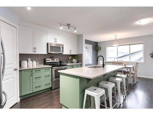 11 Reunion Grove Nw, Airdrie, AB - Indoor Photo Showing Kitchen With Upgraded Kitchen