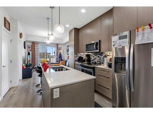 1333-76 Cornerstone Passage Ne, Calgary, AB - Indoor Photo Showing Kitchen With Double Sink With Upgraded Kitchen