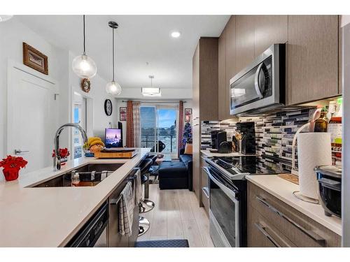 1333-76 Cornerstone Passage Ne, Calgary, AB - Indoor Photo Showing Kitchen With Double Sink With Upgraded Kitchen