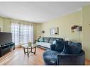 62 Cranberry Close Se, Calgary, AB  - Indoor Photo Showing Living Room 