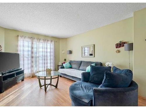 62 Cranberry Close Se, Calgary, AB - Indoor Photo Showing Living Room