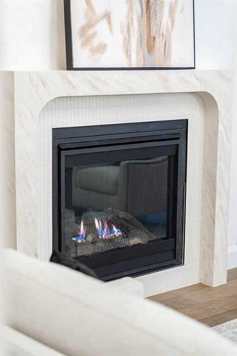 2040 56 Avenue Sw, Calgary, AB - Indoor Photo Showing Living Room With Fireplace