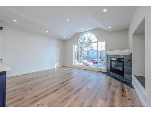 1435 42 Street Ne, Calgary, AB - Indoor Photo Showing Living Room With Fireplace